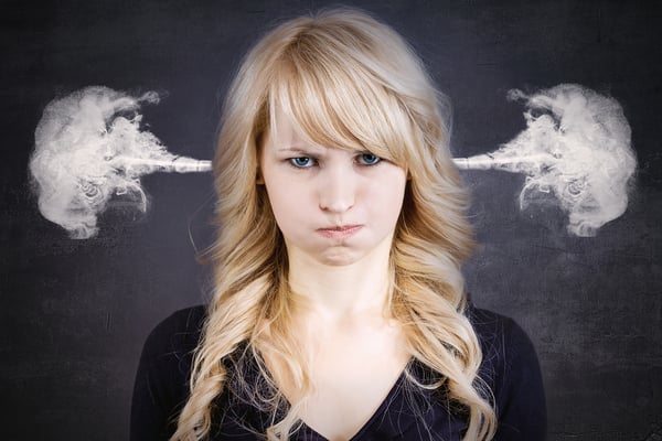 Negative review response, a closeup portrait of angry young woman, blowing steam coming out of ears, about to have nervous atomic breakdown, isolated black background. Negative human emotions facial expression feelings attitude