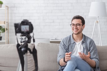 Successful man talking to camera to use video marketing seo tips he learned for his marketing strategy