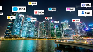 Social media icons fly over city skyline showing importance of social media marketing strategy